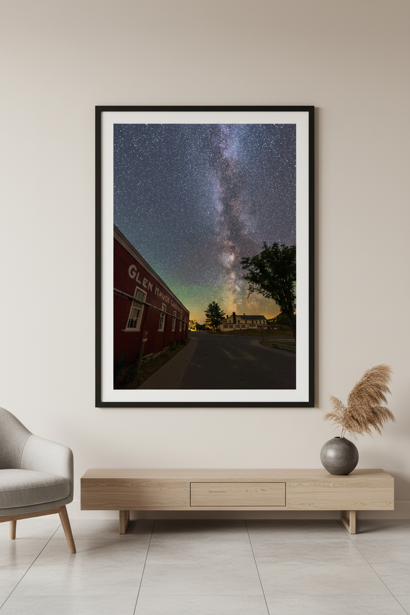 Large fine art portrait print of the Milky Way rising over the historic Glen Haven Canning Co building and Sleeping Bear Inn village road Glen Haven Michigan Sleeping Bear Dunes July 31 2022 displayed in modern living room