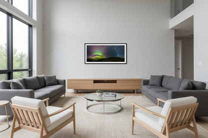 Small panoramic aurora borealis print displayed on living room wall - room mockup