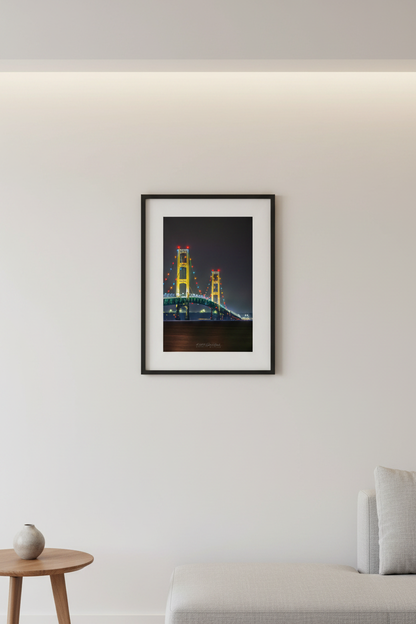 Small fine art portrait print of the Mackinac Bridge two towers lit up at night with colorful holiday lights displayed in modern living room