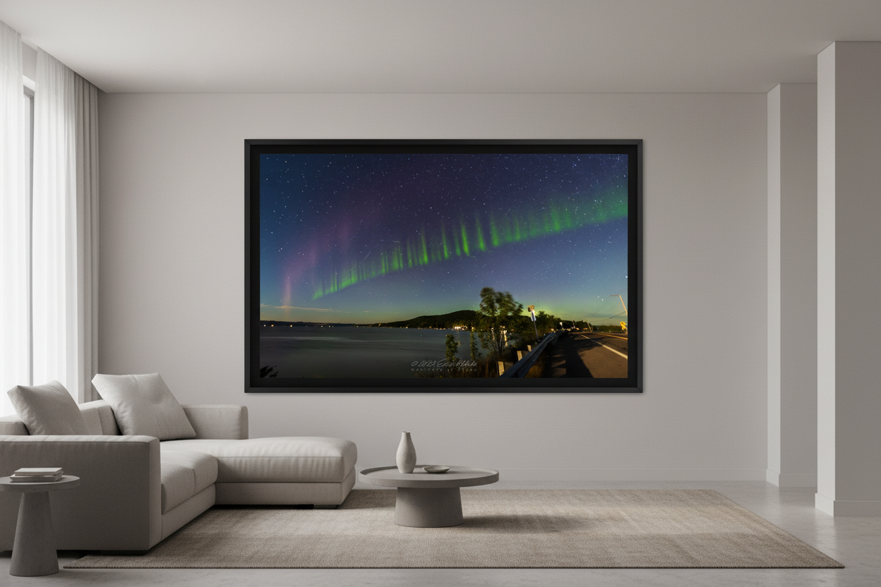Large fine art landscape print of rare S.T.E.V.E. and Picket Fence aurora with vivid green curtains and purple arc sweeping across a deep blue star-filled sky over Little Glen Lake at Glen Arbor Narrows on M-22 Michigan September 4 2022 displayed in modern living room