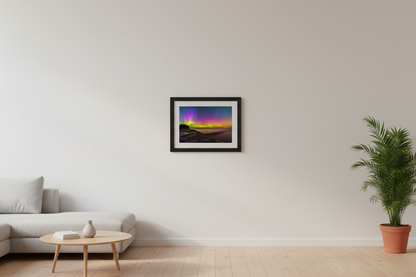 Small fine art landscape print of vivid full-spectrum Northern Lights aurora borealis with magenta purple and chartreuse green pillars over Shalda Creek beach at Sleeping Bear Dunes Lake Michigan Michigan September 2 2023 displayed in modern living room