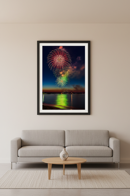 Large fine art portrait print of Traverse City Cherry Festival 2024 finale fireworks featuring crimson pink gold and green triple burst over Grand Traverse Bay from Clinch Park Beach displayed in modern living room