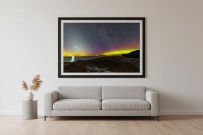 Large fine art landscape print of Venus and Northern Lights with Milky Way reflecting over Lake Michigan from North Bar Beach snow-dusted dune Sleeping Bear Dunes MI March 14 2023 displayed in modern living room