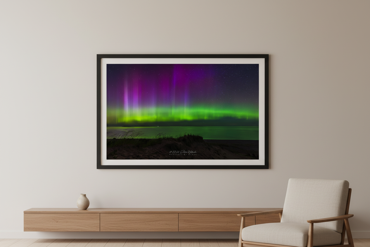 Large fine art landscape print of vivid green and purple aurora borealis pillars over Lake Michigan from Sleeping Bear Point Michigan August 11 2024 at 11:07pm with beach grass dune foreground and calm water reflection displayed in modern living room