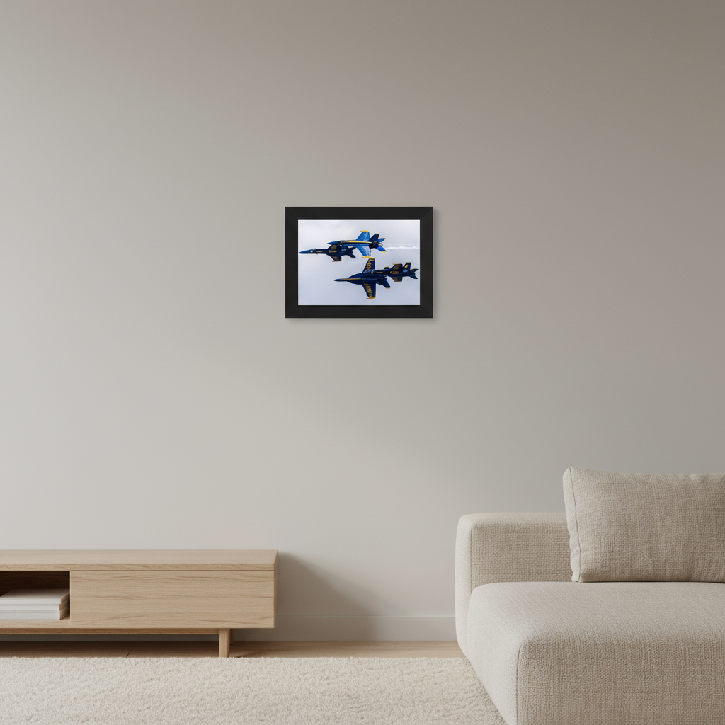 Small fine art print of four Blue Angels F/A-18 Hornets in a dramatic crossing scissors maneuver filling the frame with blue and gold livery against an overcast sky at the 2024 Traverse City Cherry Festival Airshow displayed in modern living room