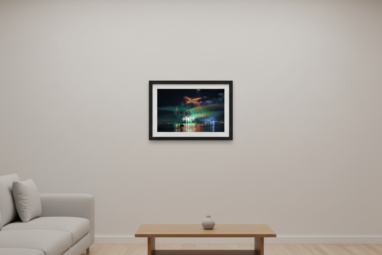 Small fine art landscape print of Traverse City 4th of July 2024 fireworks with emerald green smoke cloud, golden phoenix wing burst, and symmetrical glitter rain trails over Grand Traverse Bay displayed in modern living room