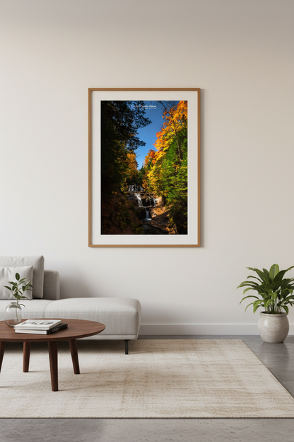 Large fine art portrait print of Sable Falls in autumn moonlight at Pictured Rocks displayed in modern living room