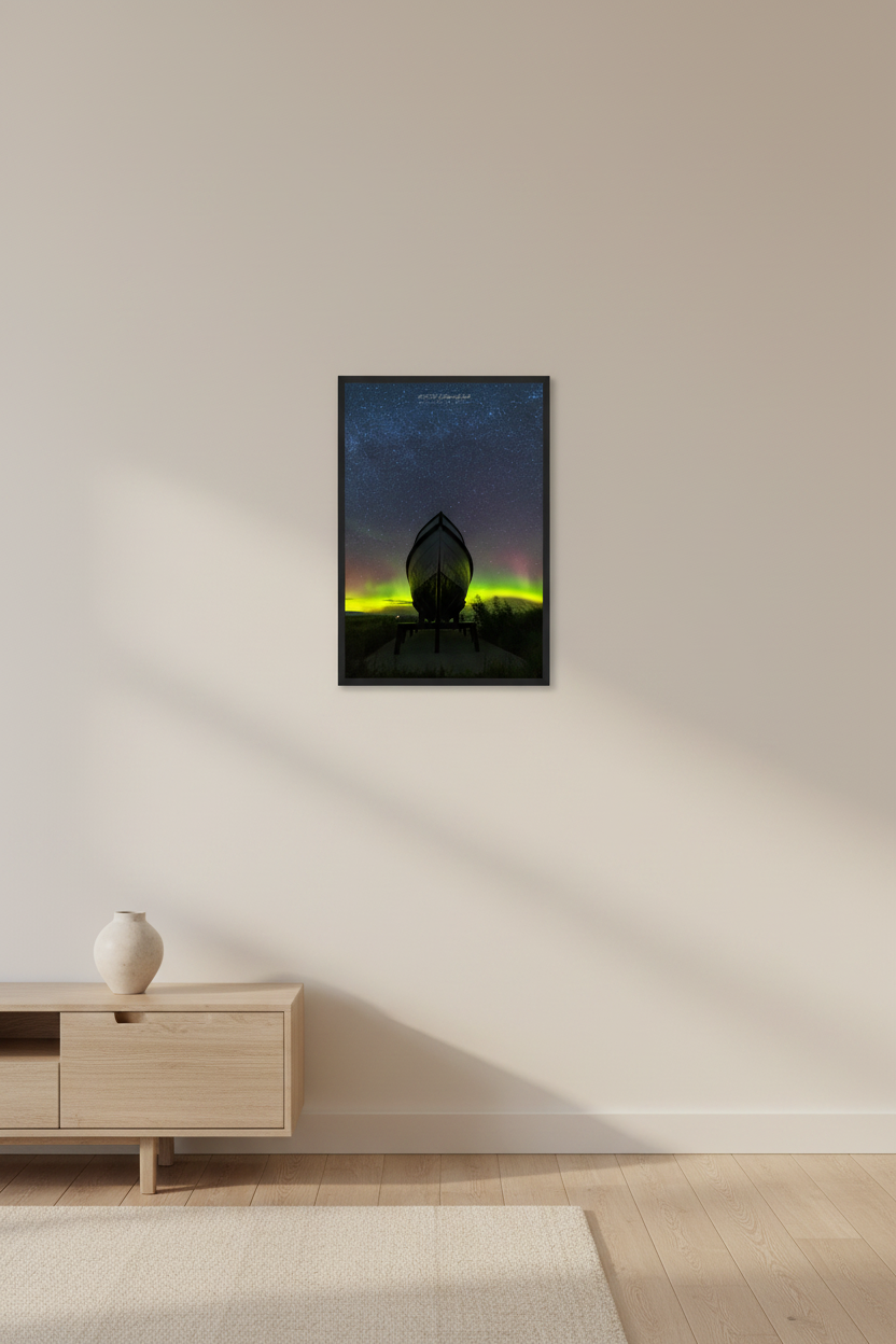 Small fine art portrait print of the historic Aloha Boat silhouetted against vivid neon green and pink aurora borealis in Glen Haven Michigan Sleeping Bear Dunes September 4 2022 displayed in modern living room