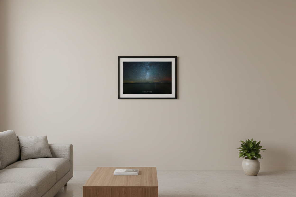 Small fine art print of Milky Way rising over Lake Michigan with North Manitou Island silhouette on horizon faint aurora glow and bright planet Leland Michigan Oct 5 2024 3:31am displayed in modern living room
