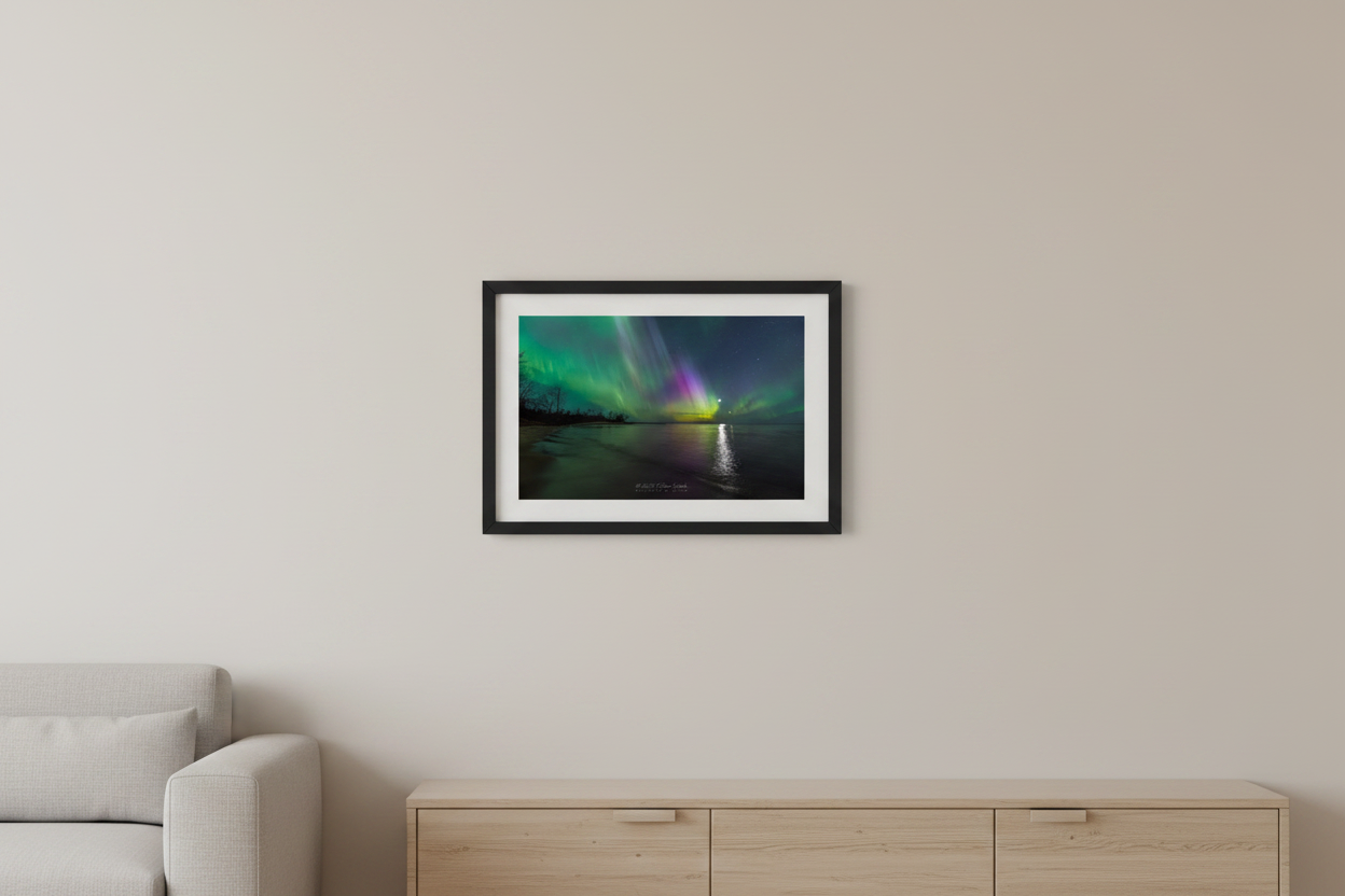 Small fine art landscape print of vivid green and magenta aurora curtains with Moon and Venus reflecting over Misery Bay Lake Superior Michigan Upper Peninsula April 24 2023 displayed in modern living room