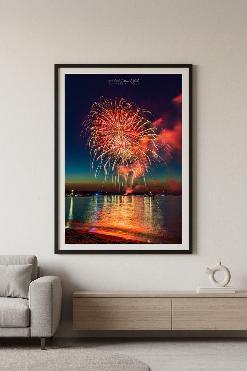 Large fine art portrait print of Traverse City Cherry Festival 2024 finale fireworks featuring massive red peony and gold willow burst filling the sky over Grand Traverse Bay from Clinch Park Beach displayed in modern living room