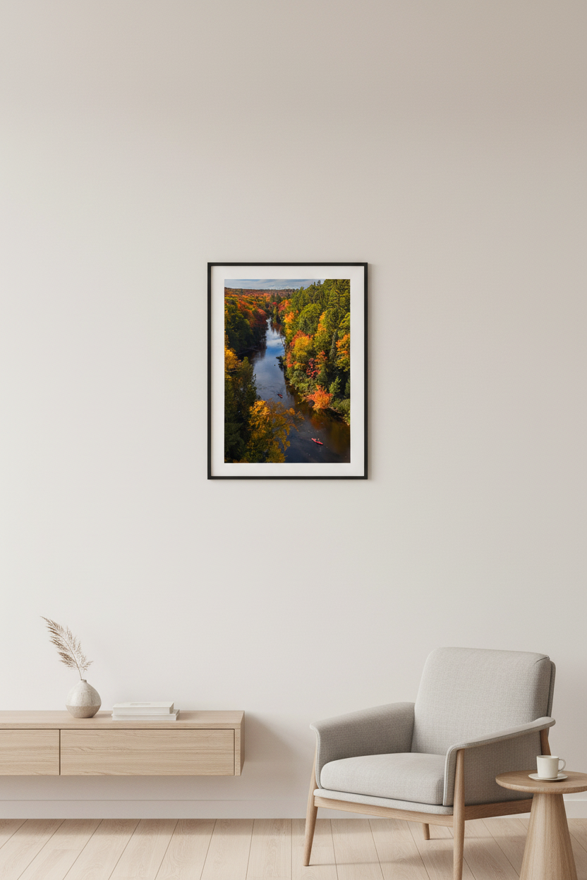 Small fine art portrait print of kayakers on the Dead River surrounded by peak fall foliage in Michigan's Upper Peninsula displayed in modern living room
