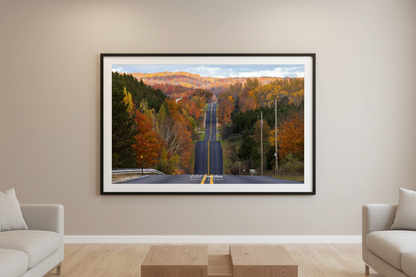 Large fine art landscape print of Schomberg Road Roller Coaster Hill fall color Michigan displayed in modern living room