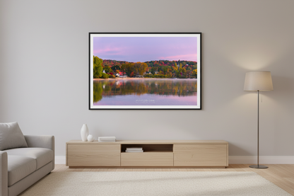 Large fine art landscape print of autumn sunrise reflection over Sutton's Bay Michigan displayed in modern living room