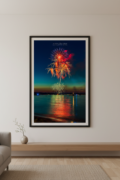 Large fine art portrait print of Traverse City Cherry Festival 2024 finale fireworks featuring twin golden palm tree bursts red peony and teal green globe over Grand Traverse Bay from Clinch Park Beach displayed in modern living room