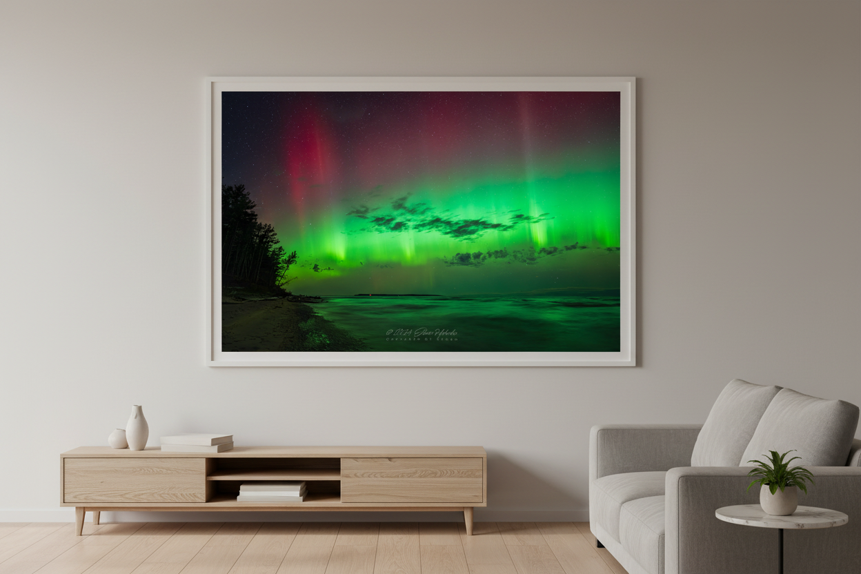 Large fine art landscape print of vivid neon green aurora curtains and crimson red upper aurora with dark cloud bank over Lake Michigan sandy beach shoreline at Port Oneida Sleeping Bear Dunes Michigan October 7 2024 at 10:18pm displayed in modern living room