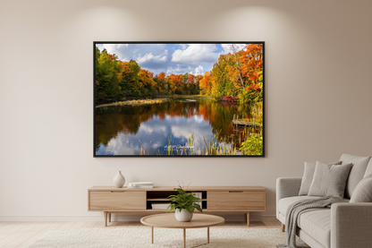 Large fine art landscape print of fall color reflections at Belanger Creek Michigan displayed in modern living room
