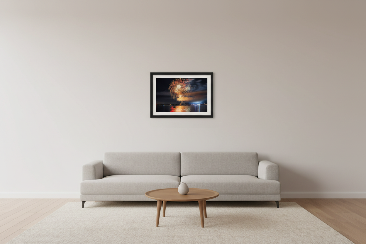 Small fine art landscape print of Traverse City 4th of July 2024 fireworks showing a full spherical gold and crimson peony burst with white starburst core and warm red-gold water reflection over Grand Traverse Bay displayed in modern living room