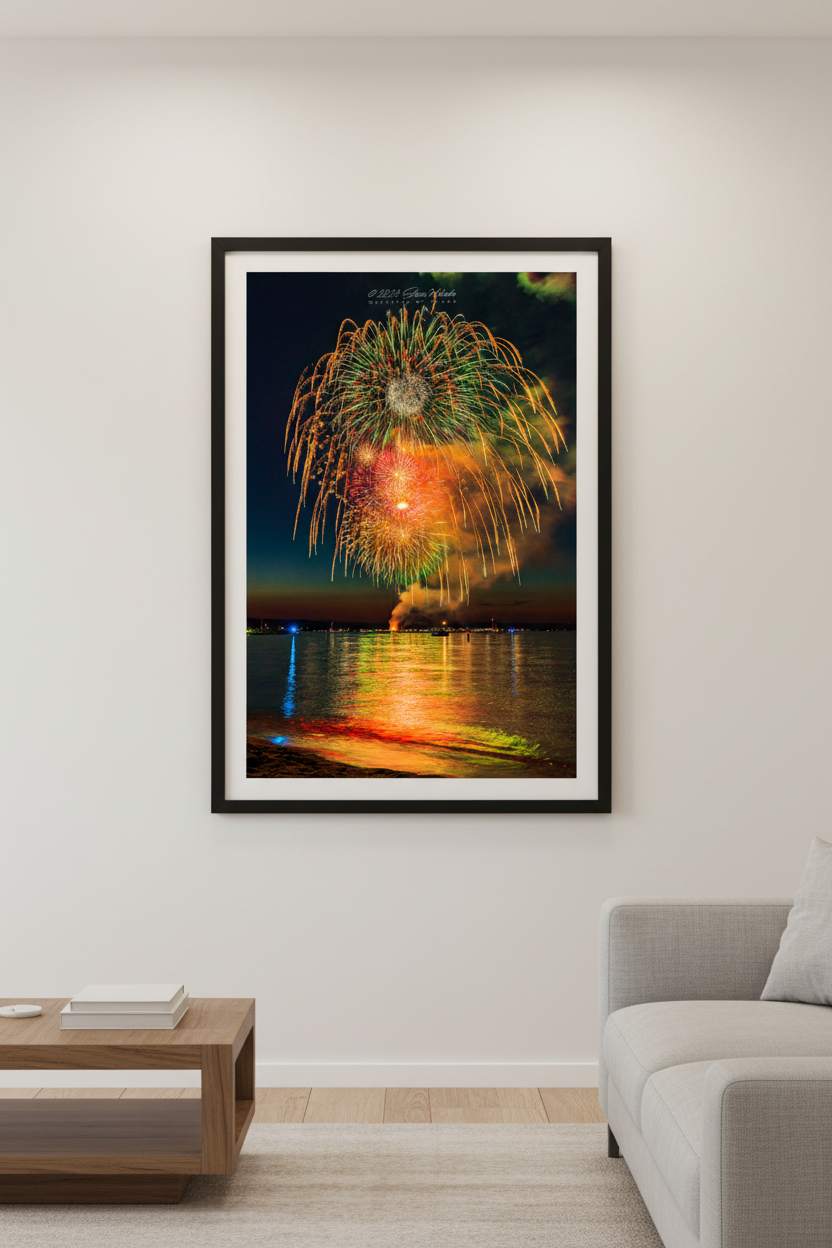 Large fine art portrait print of Traverse City Cherry Festival 2024 finale fireworks featuring multi-level green willow canopy with layered gold pink and white bursts over Grand Traverse Bay from Clinch Park Beach displayed in modern living room