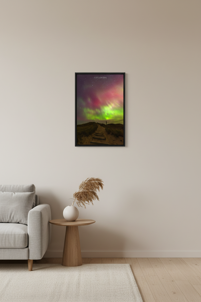 Small fine art portrait print of wooden boardwalk staircase with rope railings leading through sand dunes toward vivid green and crimson aurora display at North Bar Lake Michigan October 11 2024 at 1:33am displayed in modern living room