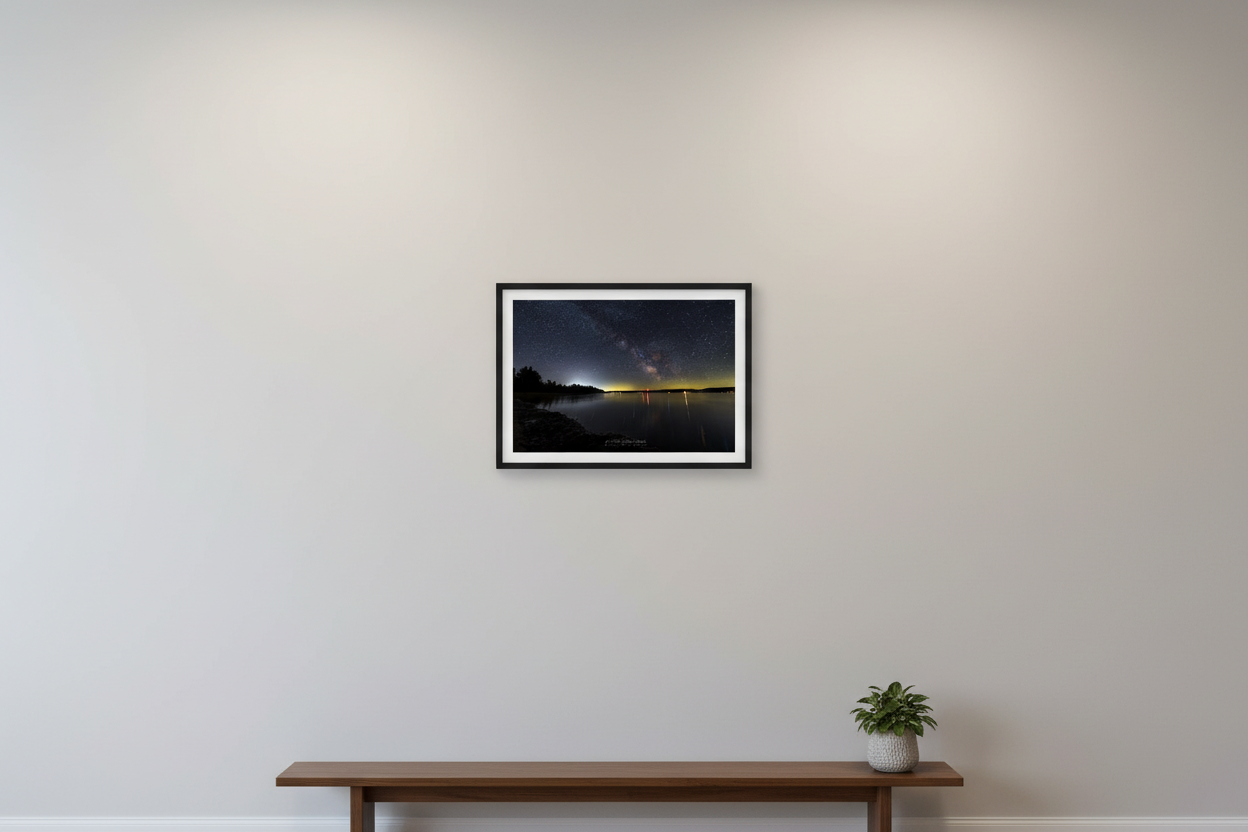 Small fine art landscape print of the Milky Way core rising over Little Glen Lake at Sleeping Bear Dunes Michigan with colorful light reflections on calm water April 7 2024 displayed in modern living room