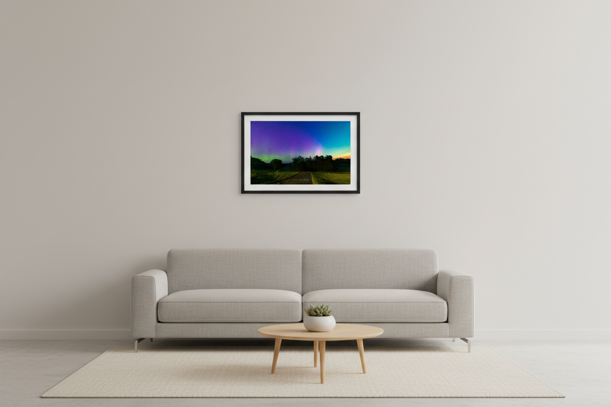 Small fine art landscape print of full-spectrum aurora with purple violet canopy green band and white pink pillar over silhouetted trees at Leland Golf Course Michigan September 17 2024 at 6:19am with teal to amber horizon glow displayed in modern living room