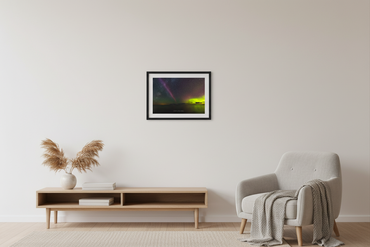 Small fine art landscape print of S.T.E.V.E. aurora and Milky Way together over Lake Michigan at Christmas Cove Beach Northport Michigan September 19 2023 at 12:10am with crimson pink aurora pillar and electric green aurora glow reflecting on calm water displayed in modern living room
