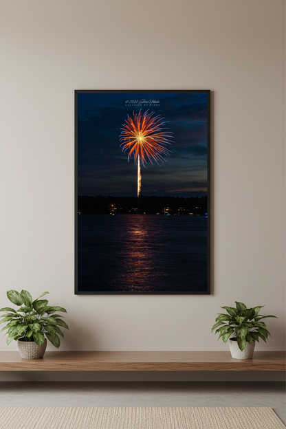 Large fine art portrait print of single red orange firework burst with golden launch trail and lake reflection over Lake Leelanau Leland Michigan July 3 2024 displayed in modern living room