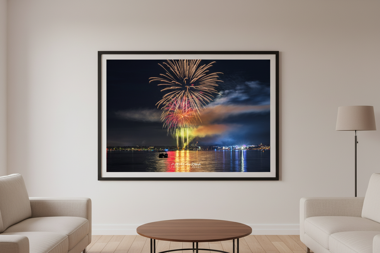 Large fine art landscape print of Traverse City 4th of July 2024 fireworks with tall golden launch columns, rainbow smoke base, and colorful multi-stage burst over Grand Traverse Bay displayed in modern living room