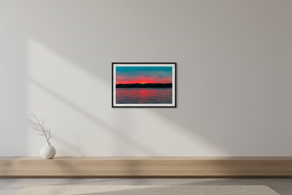 Small fine art print of Lake Leelanau fire sunset afterglow pure minimalist composition smooth atmospheric sky gradient red-orange to salmon-pink to dusty mauve to soft teal-blue no foreground objects teal-dominant water scattered red-pink ripple reflections Leland Michigan displayed in modern living room