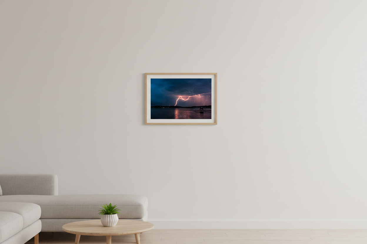 Small fine art landscape print of double lightning strike over Lake Leelanau from Leland Michigan displayed in modern living room