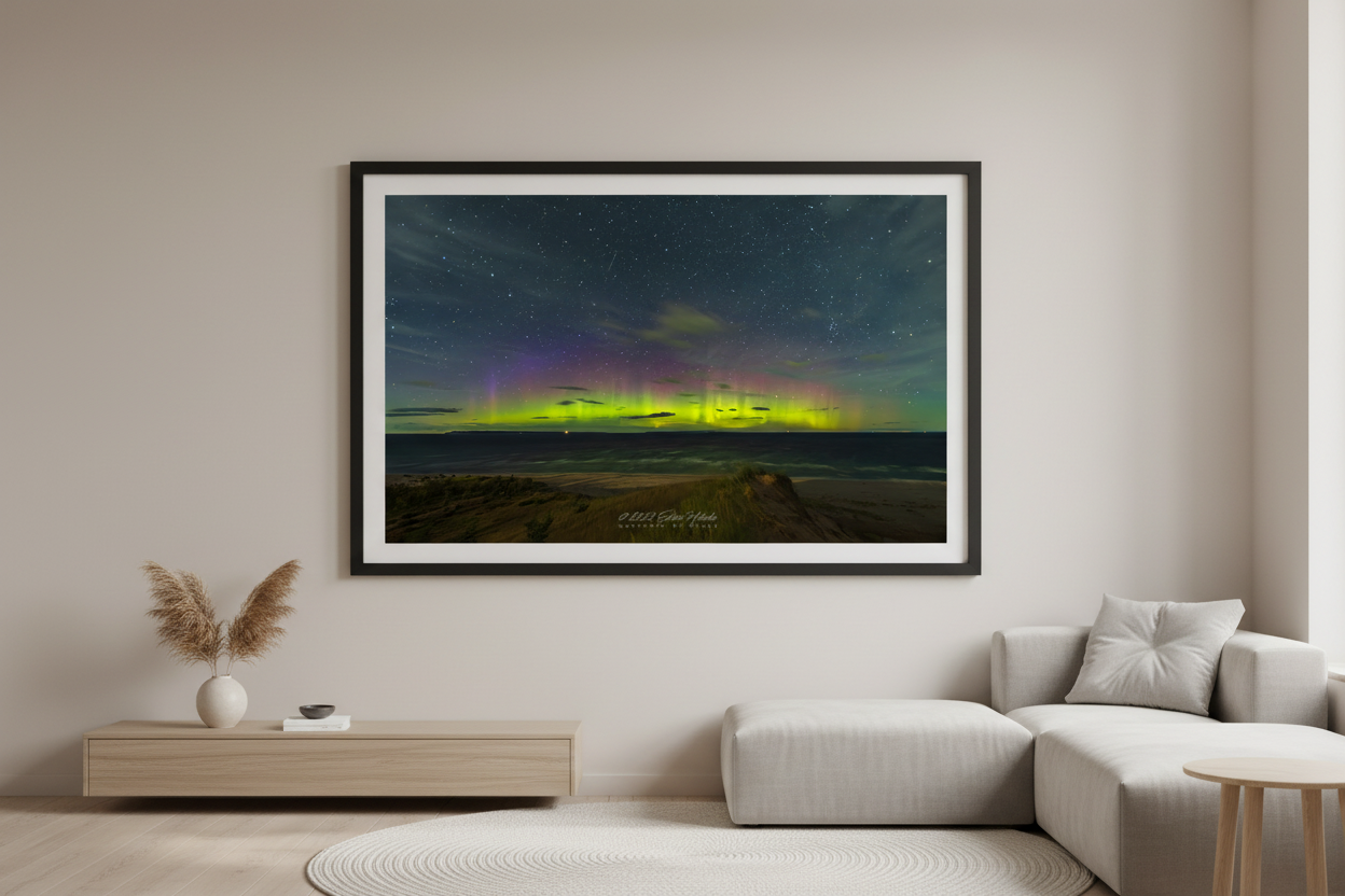 Large fine art landscape print of vivid yellow-green aurora pillars and purple magenta band over Lake Michigan from elevated beach overlook at Sleeping Bear Dunes Michigan September 3 2022 displayed in modern living room