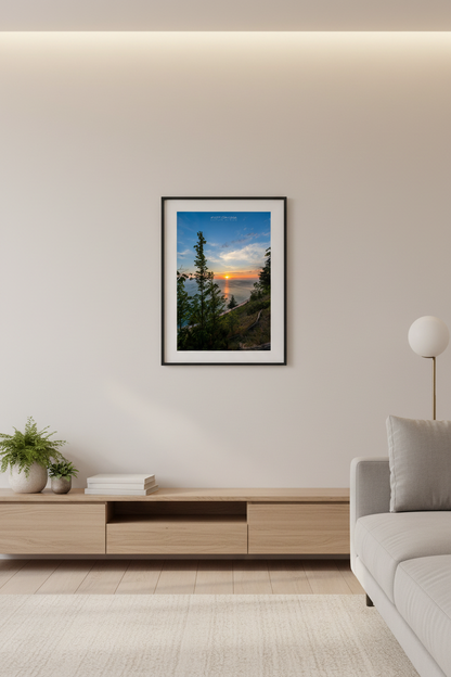 Small fine art portrait print of a vibrant sunset over Lake Michigan viewed through trees from Empire Bluffs at Sleeping Bear Dunes displayed in modern living room