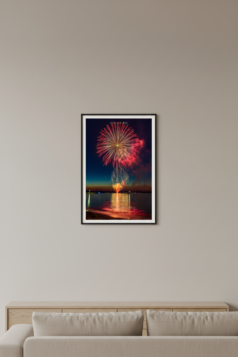 Small fine art portrait print of Traverse City Cherry Festival 2024 finale fireworks featuring perfect spherical red peony burst with gold launch trail and star-filled sky over Grand Traverse Bay from Clinch Park Beach displayed in modern living room