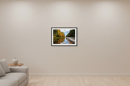 Small fine art landscape print of fall color reflecting in a roadside rain puddle in Leelanau County Michigan displayed in modern living room