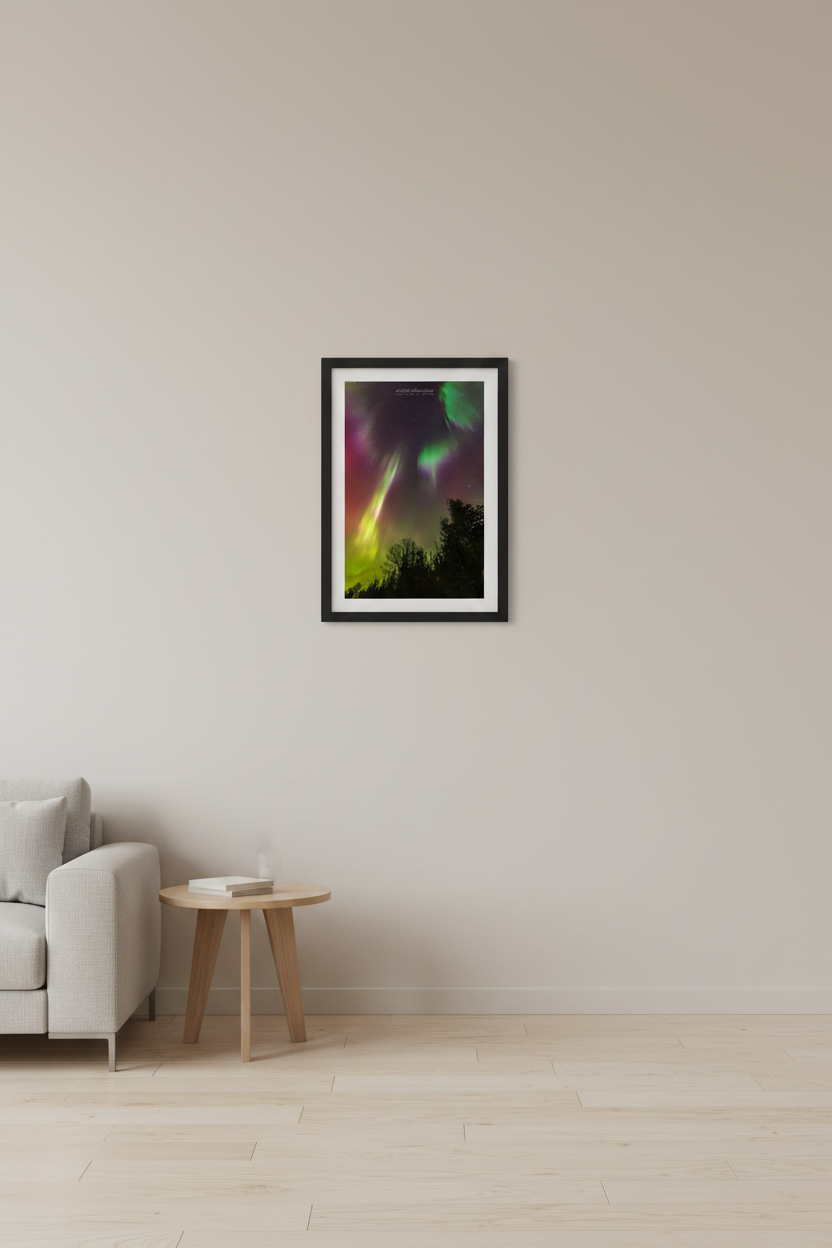 Small fine art portrait print of twin diagonal aurora pillars in vivid yellow-green and pinkish-white against deep purple-magenta sky with crimson red aurora glow and silhouetted tree line at North Bar Lake Michigan October 11 2024 at 1:12am displayed in modern living room