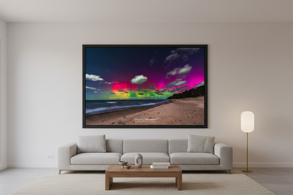 Large fine art landscape print of vivid magenta crimson and green Northern Lights aurora pillars over Lake Michigan beach near Leland Michigan December 1 2023 at 6:17am with dramatic clouds lit by aurora glow displayed in modern living room