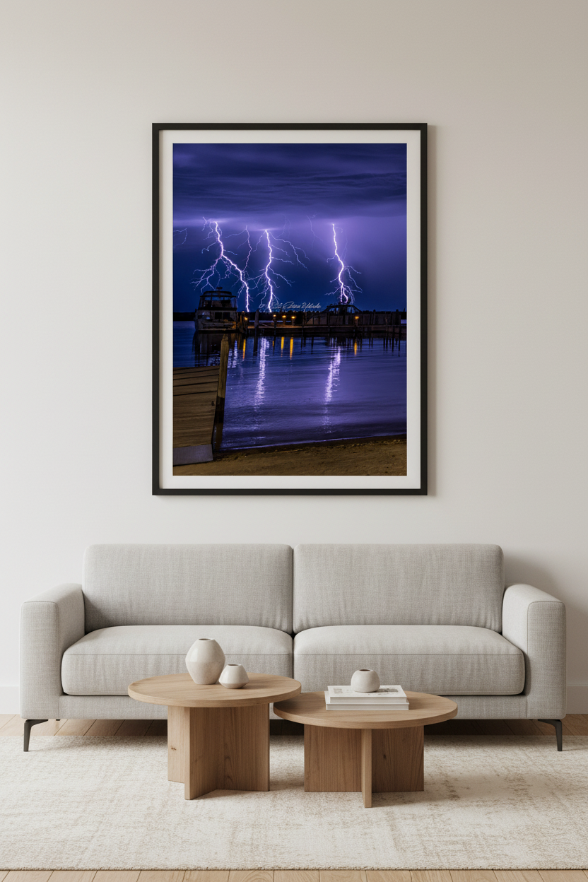 Large fine art portrait print of triple lightning strike above Leland Michigan displayed in modern living room