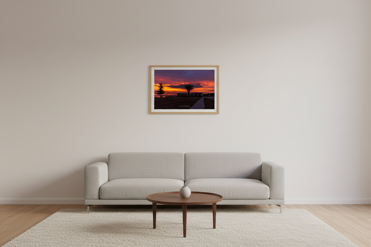 Small fine art landscape print of fiery sunrise over Glen Haven Canning Co building Sleeping Bear Dunes Michigan displayed in modern living room