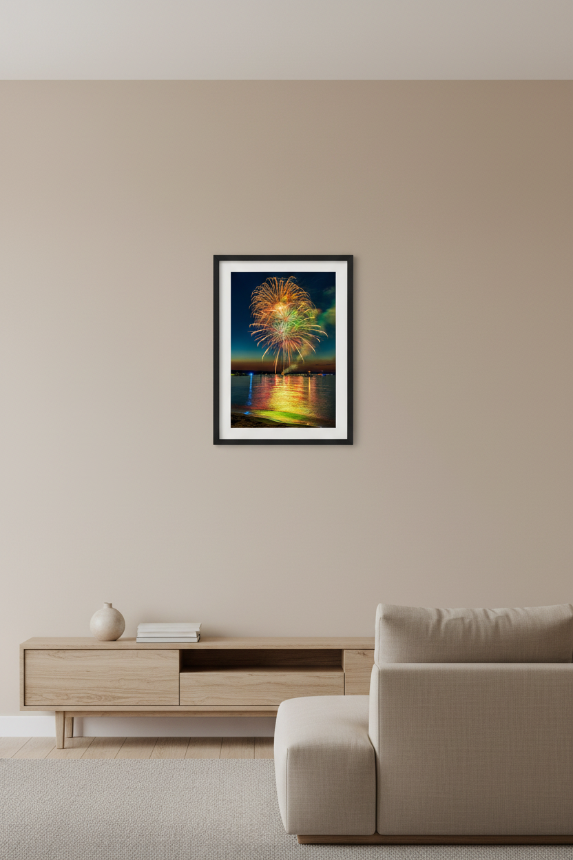 Small fine art portrait print of Traverse City Cherry Festival 2024 finale fireworks featuring golden chrysanthemum dome burst with white starburst core pink streamers and vivid green accent over Grand Traverse Bay from Clinch Park Beach displayed in modern living room
