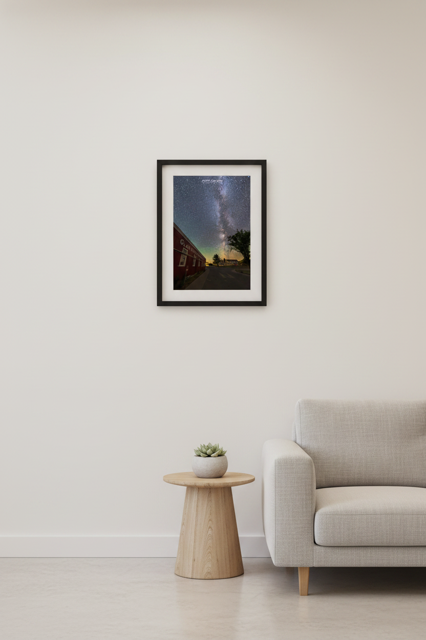 Small fine art portrait print of the Milky Way rising over the historic Glen Haven Canning Co building and Sleeping Bear Inn village road Glen Haven Michigan Sleeping Bear Dunes July 31 2022 displayed in modern living room