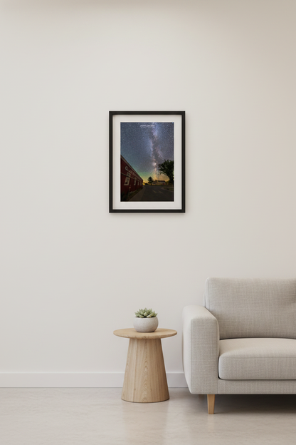 Small fine art portrait print of the Milky Way rising over the historic Glen Haven Canning Co building and Sleeping Bear Inn village road Glen Haven Michigan Sleeping Bear Dunes July 31 2022 displayed in modern living room