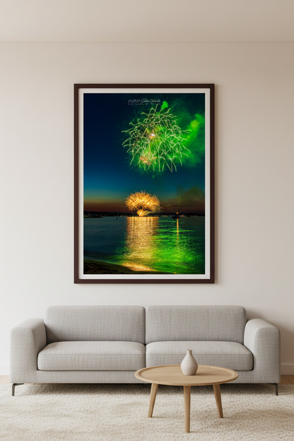 Large fine art portrait print of Traverse City Cherry Festival 2024 finale fireworks featuring electric green and gold bursts reflecting over Grand Traverse Bay from Clinch Park Beach displayed in modern living room