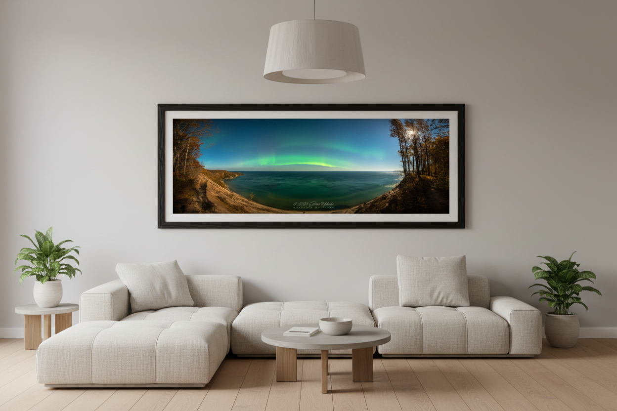 Large fine art 3:1 panoramic print of northern lights aurora borealis arc over Lake Superior from Log Slide Overlook Grand Sable Dunes Michigan Upper Peninsula October 2024 displayed in modern living room
