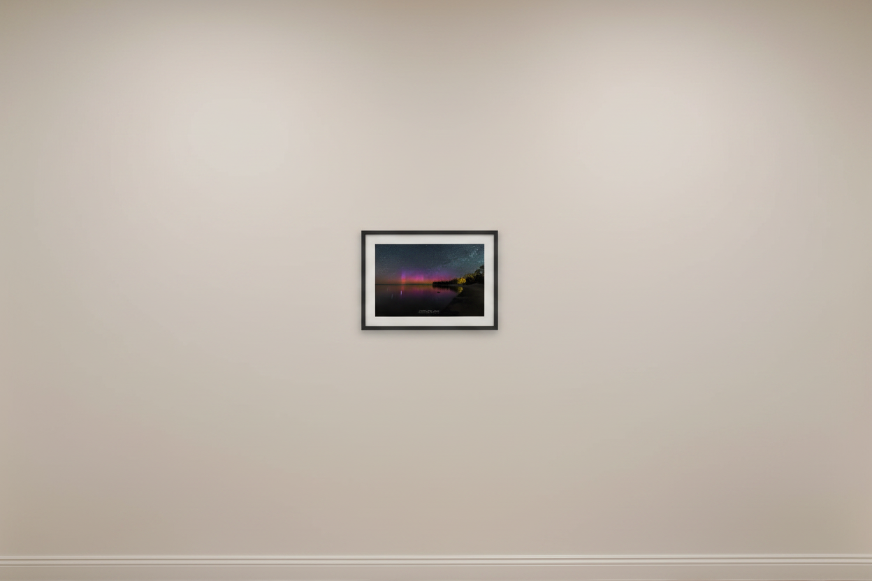 Small fine art landscape print of vivid purple and magenta Northern Lights aurora borealis pillars reflecting in calm Lake Michigan from Gills Pier Leelanau County Michigan May 6 2024 displayed in modern living room