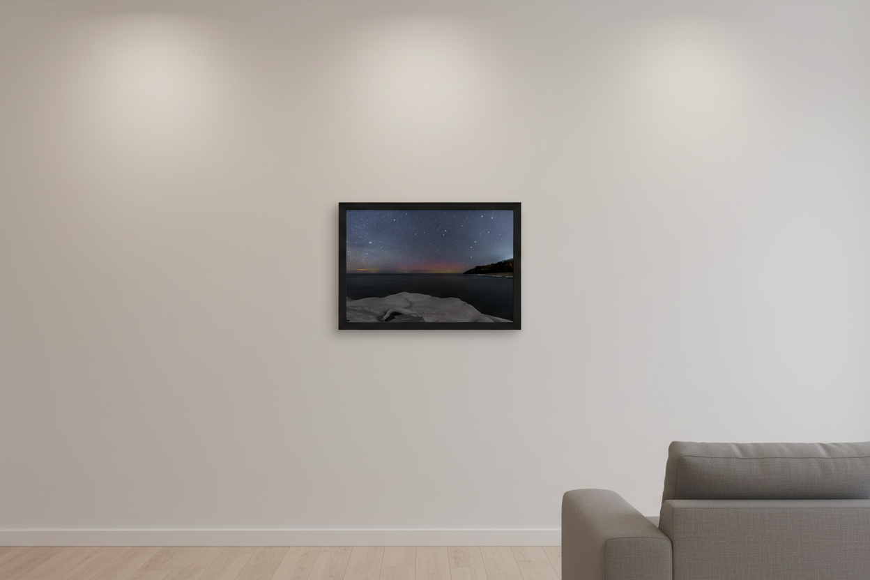 Small fine art landscape print of crimson and magenta Northern Lights aurora borealis with Big Dipper over snow and ice shoreline at North Street Beach Leland Lake Michigan February 8 2023 displayed in modern living room
