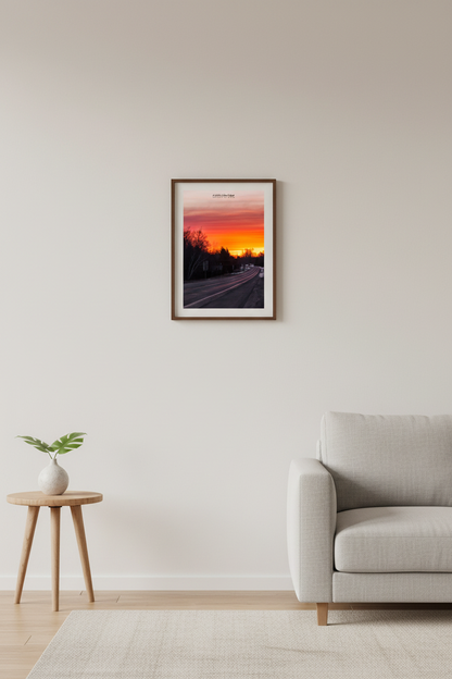 Small fine art portrait print of fiery M-204 highway sunrise with winter tree silhouettes in Leelanau County Michigan displayed in modern living room