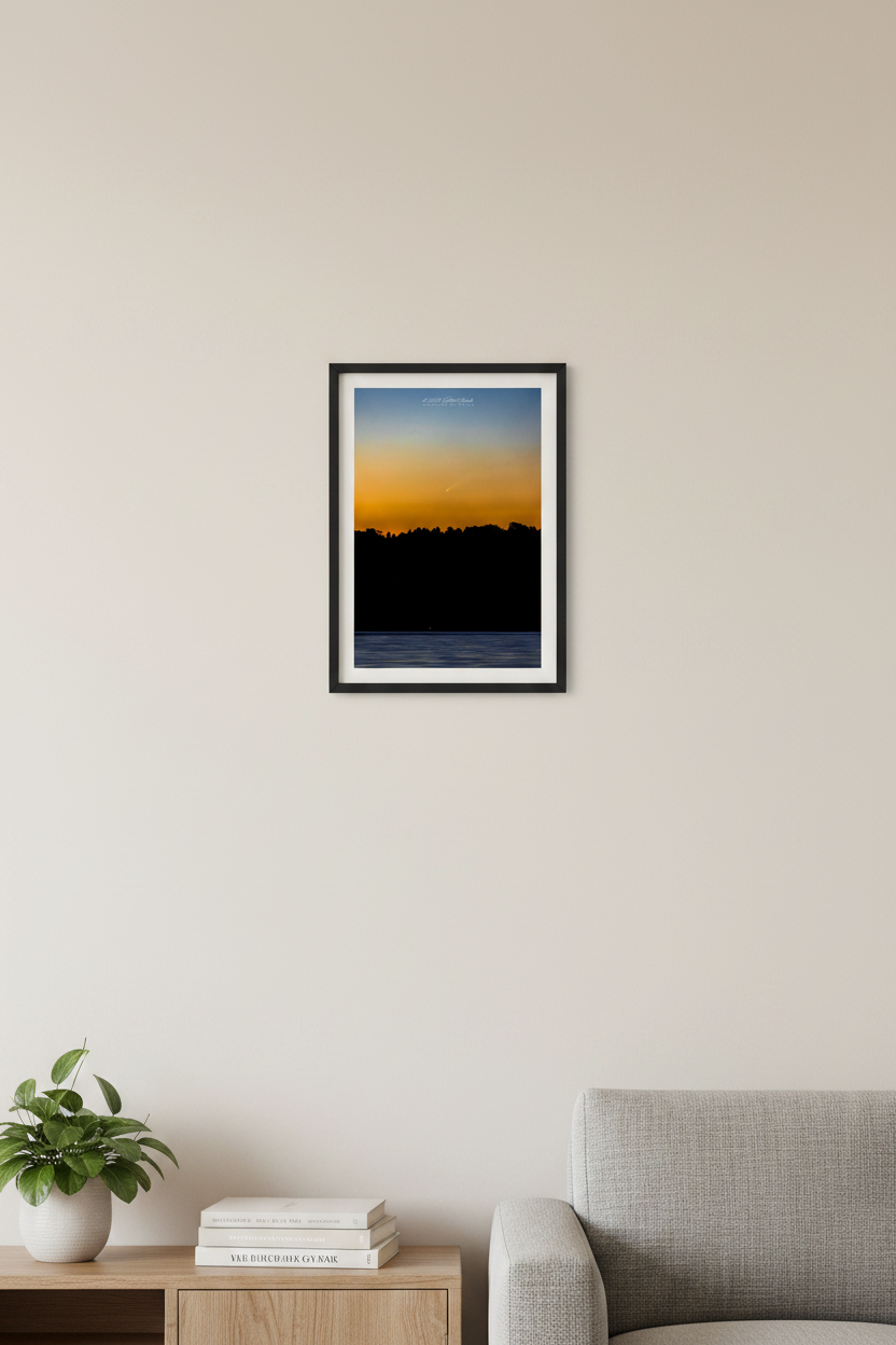 Small fine art portrait print of Comet Tsuchinshan-ATLAS C/2023 A3 rising over Lake Leelanau at sunrise golden amber orange sky treeline silhouette near-black water Leland Michigan Sep 29 2024 displayed in modern living room
