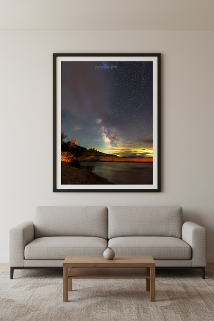 Large fine art portrait print of the Milky Way core blazing over Otter Creek at Sleeping Bear Dunes Michigan with Perseid meteor streaks sandy dunes and golden horizon August 12 2023 displayed in modern living room