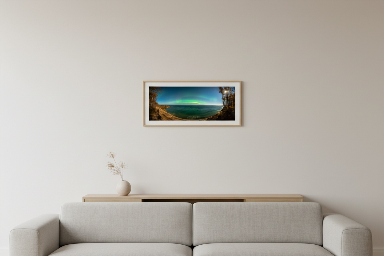 Small fine art 3:1 panoramic print of northern lights aurora borealis arc over Lake Superior from Log Slide Overlook Grand Sable Dunes Michigan Upper Peninsula October 2024 displayed in modern living room